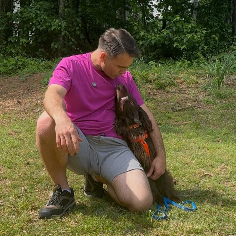 Joel Harrison with a dog outdoors